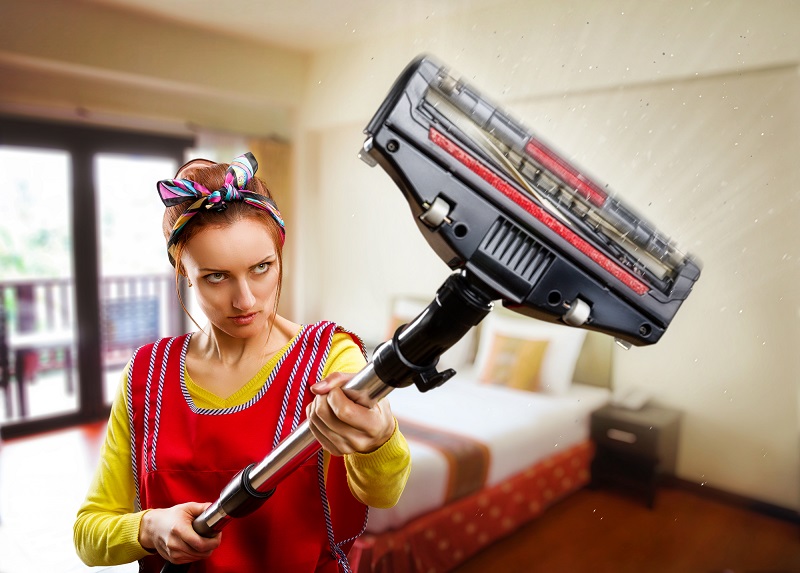 vacuum cleaner accessories make job easier - Housewife with vacuum cleaner